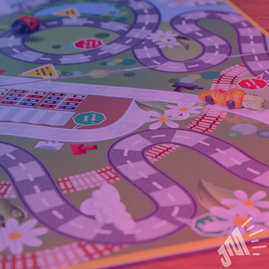 Close up of board game. The Just Marketing logo is in the lower right hand corner.